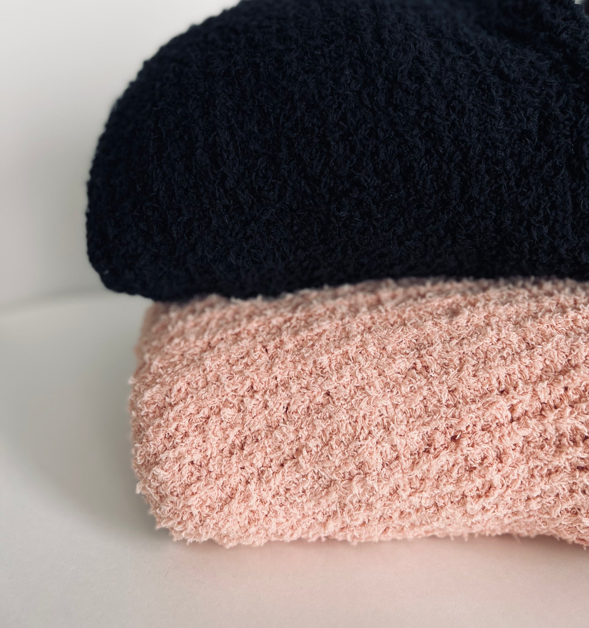 black sweater peach sweater